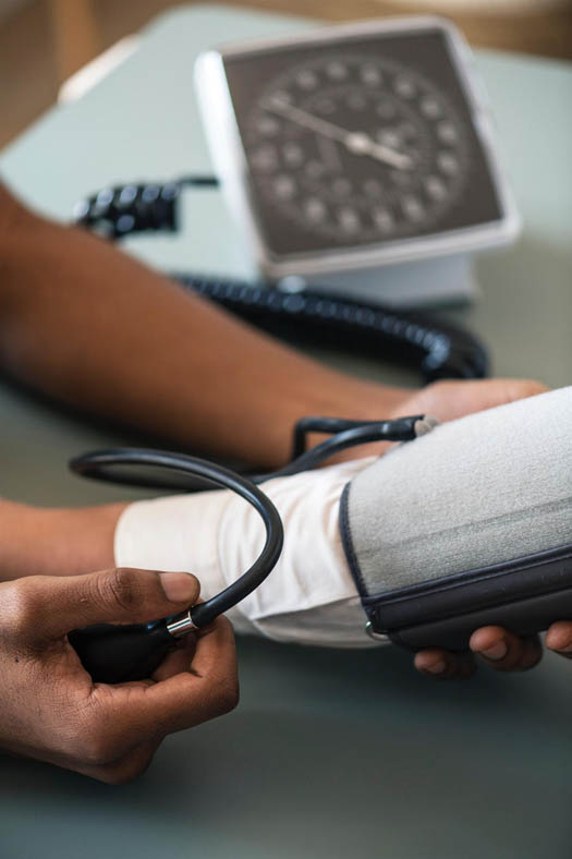 Close-up of a doctor taking a patient's blood pressure