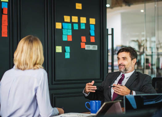 Man and woman engaged in advisory board negotiations