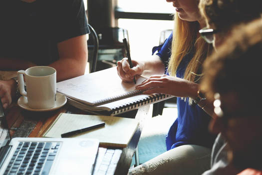 Group of young business people discussing stewardship in business