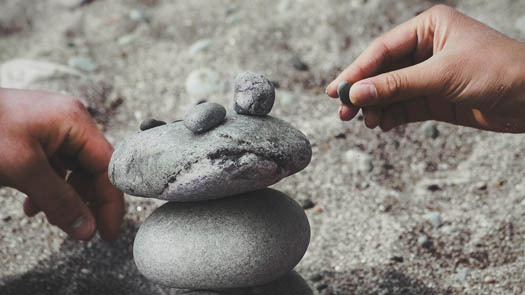 Rock balancing on a beach