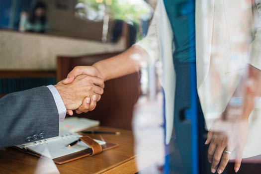 Handshake business acquisition deal