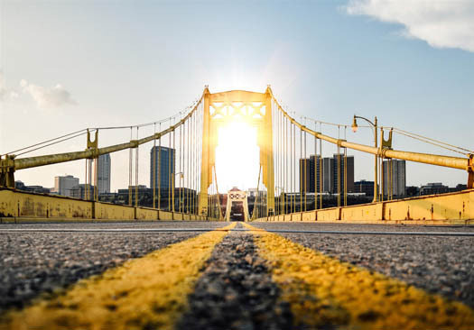 A bridge with pavement signifying being the middleman